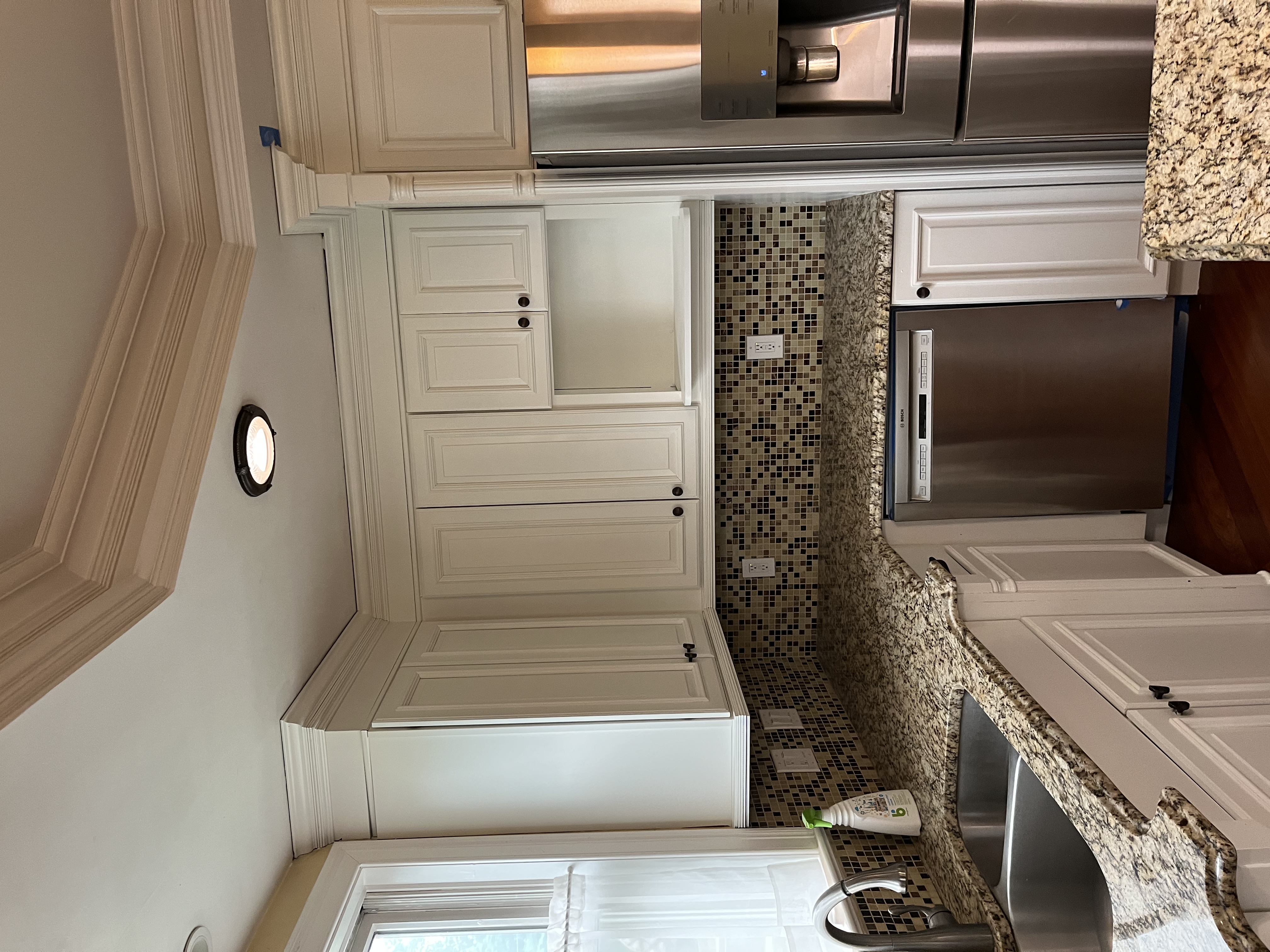 Warm wood cabinetry and matte fixtures