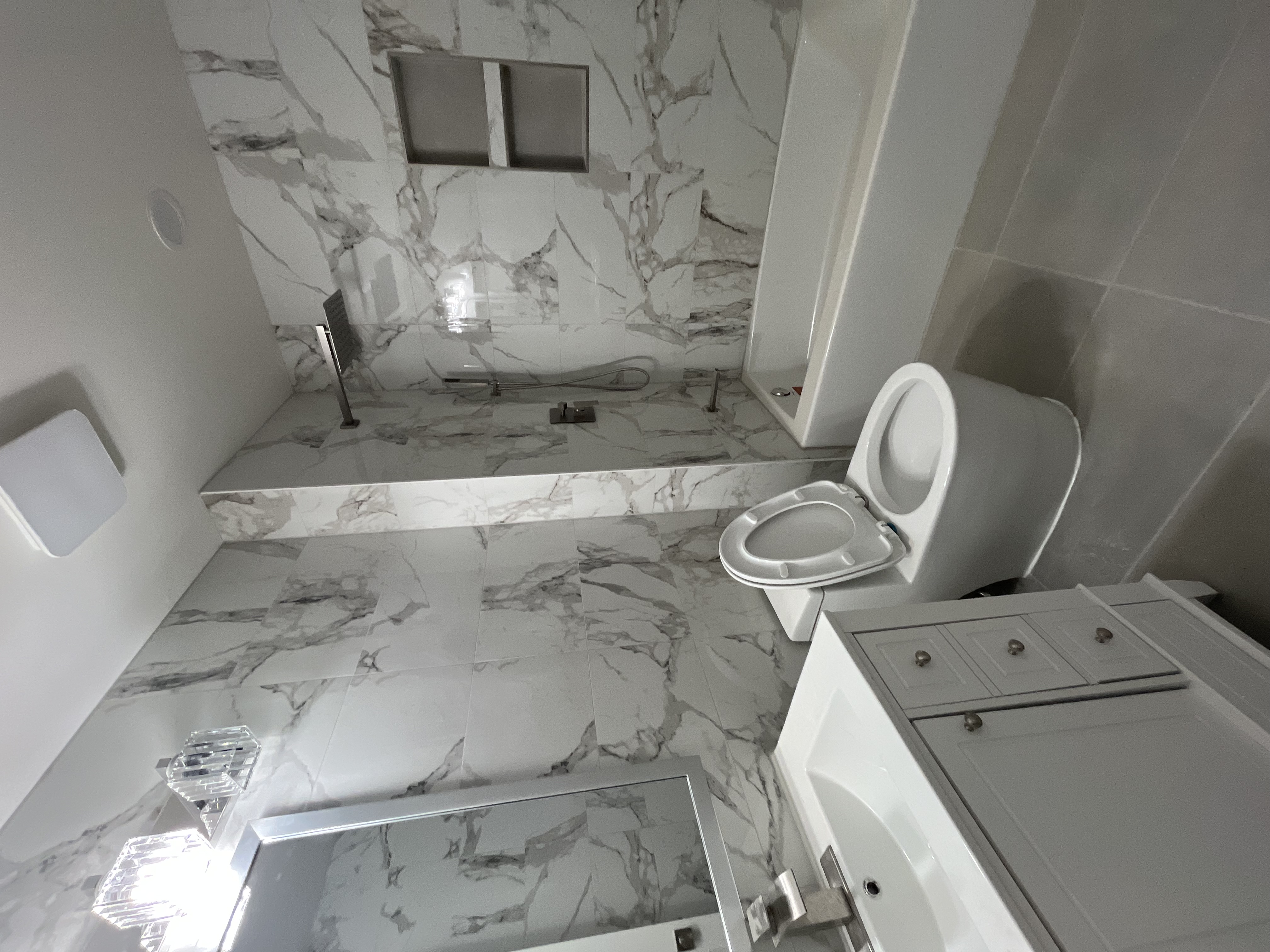 Frameless glass shower and large format tile