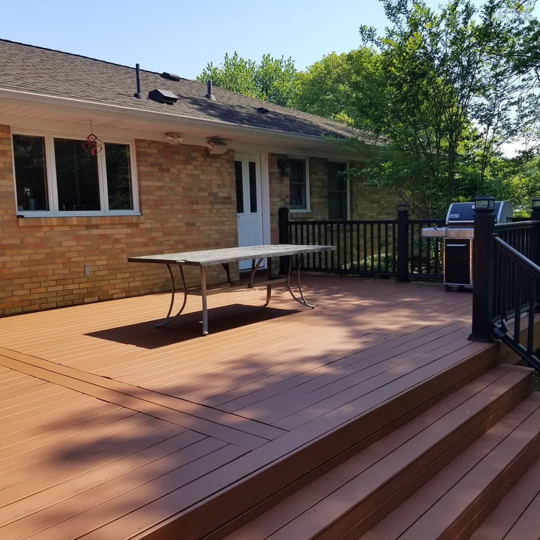 Pressure-treated deck with fresh stain and new railings